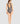 Woman seen from behind wearing a gray swimsuit on a light gray background
